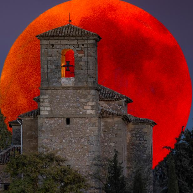 Super Blood Moon Lunar Eclipse 2018 In this photograph you can see, in the first plane, a church, and in the background, the blood moon of the last eclipse of the moon. Photo taken in july, 2018